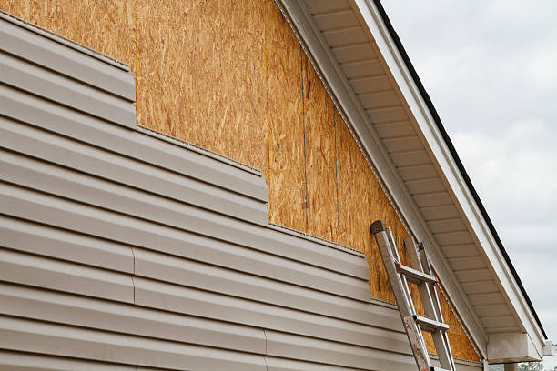 Professional Storm Damage Siding Repair technician working in Milford, VA